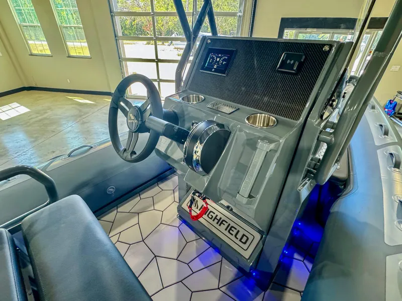 Slide: The Image of 2025 Highfield Sport 560 boat interior with steering wheel and control panel. - 10