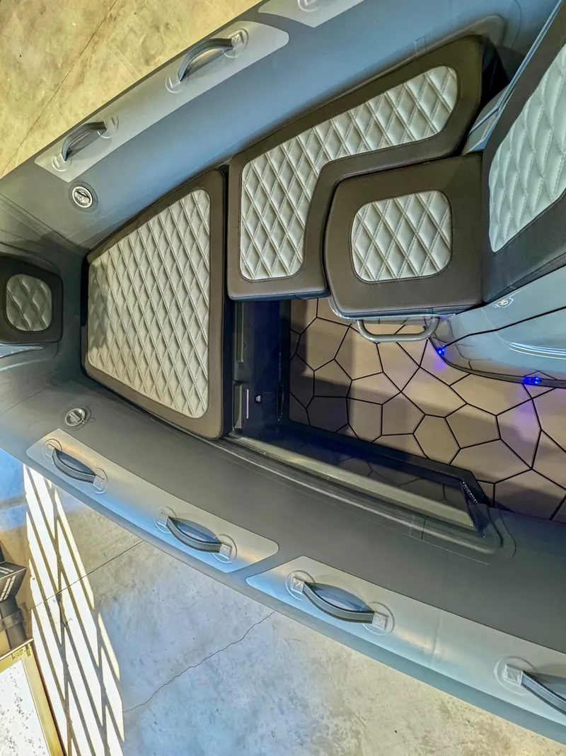 Slide: The Image of 2025 Highfield Sport 560 boat interior with quilted seating and modern design. - 13