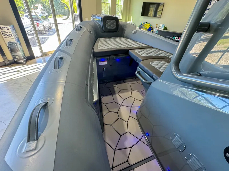 Slide: The Image of 2025 Highfield Sport 560 boat interior with modern seating and sleek design. - 14