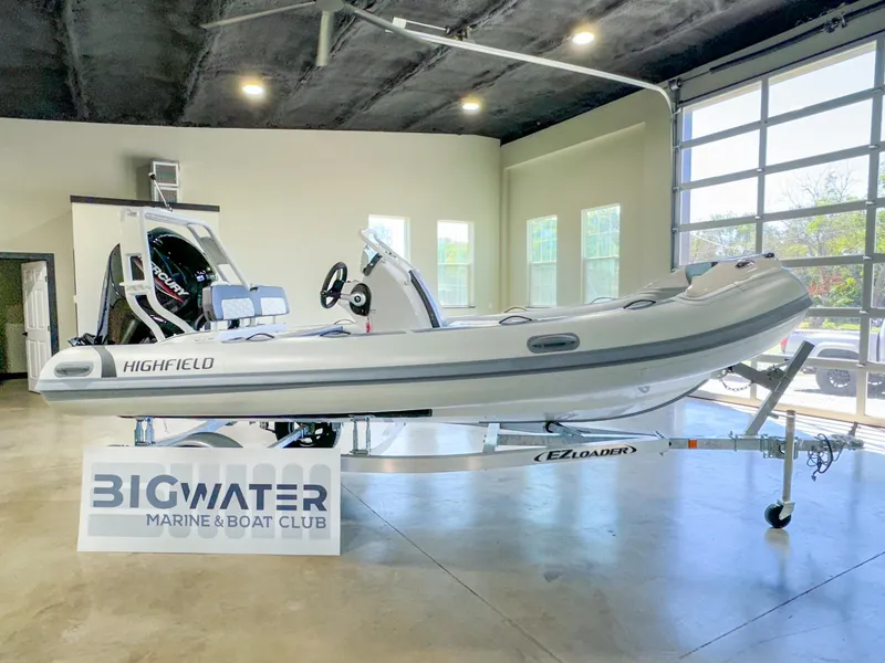 Slide: The Image of 2025 Highfield Sport 460 boat displayed indoors at Big Water Marine & Boat Club. - 0