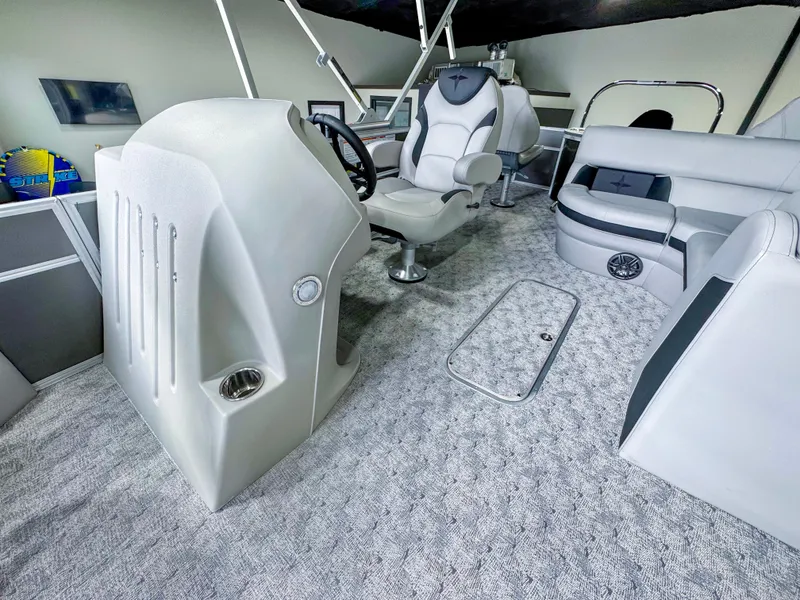 Slide: The Image of Interior of a 2025 Berkshire 20′ LE pontoon boat with modern seating and helm. - 10
