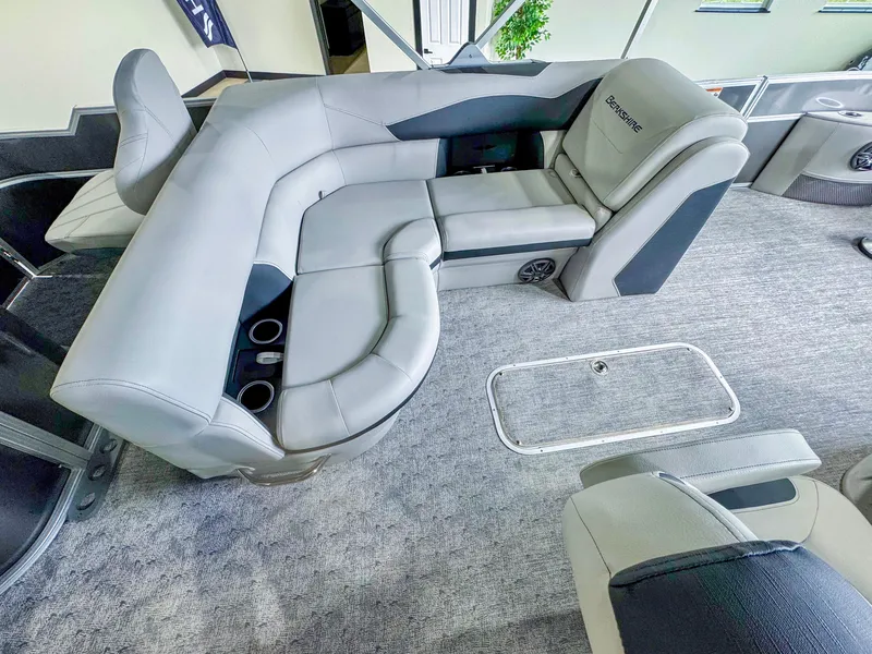 Slide: The Image of Luxurious interior of 2025 Berkshire 20′ LE pontoon boat with plush seating and cup holders. - 11