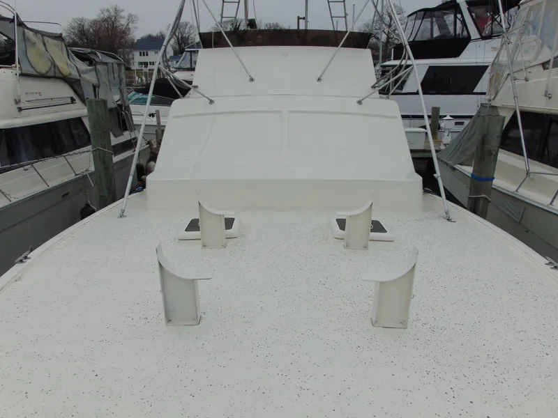 Slide: The Image of 1981 Post 46 Sportfish boat deck, docked among other vessels. - 19