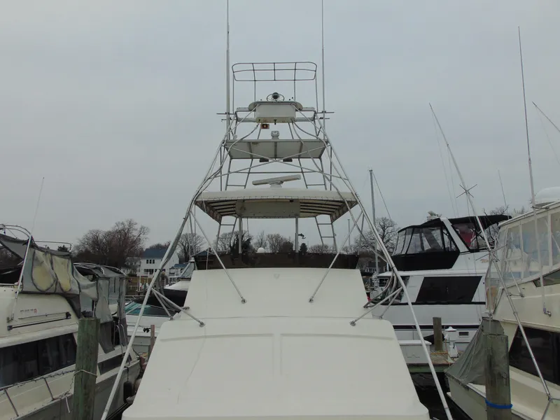 Slide: The Image of 1981 Post 46 Sportfish boat docked among other vessels on a cloudy day. - 20