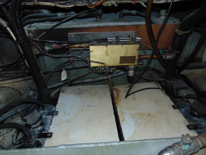 Slide: The Image of Engine compartment of 1981 Post 46 Sportfish boat with wiring and components. - 39
