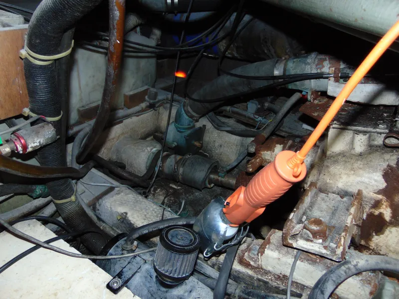 Slide: The Image of Engine compartment of a 1981 Post 46 Sportfish boat, showing various mechanical components. - 40