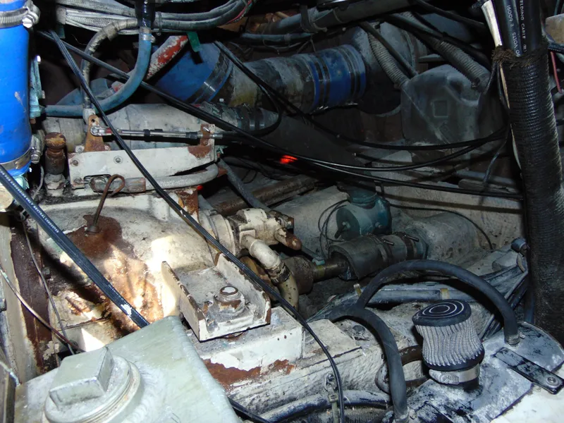 Slide: The Image of Engine room of a 1981 Post 46 Sportfish boat, showing mechanical components and wiring. - 41