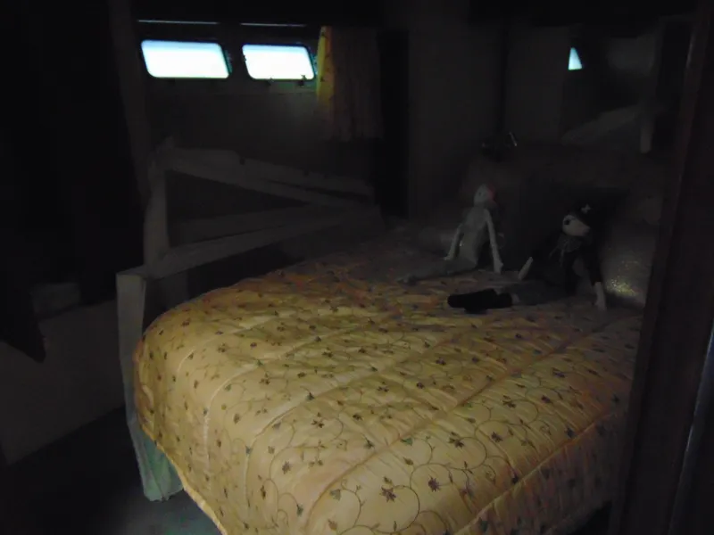 Slide: The Image of Cozy cabin bedroom in 1981 Post 46 Sportfish boat with plush toys on bed. - 10