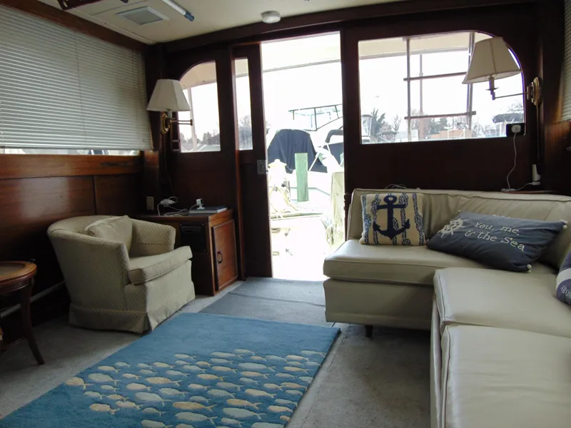 Slide: The Image of Interior of 1981 Post 46 Sportfish yacht with cozy seating and nautical decor. - 13