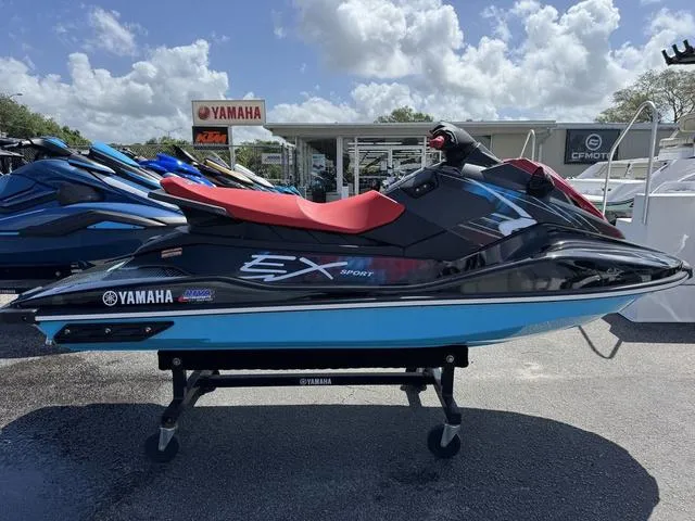 Slide: The Image of 2024 Yamaha WaveRunner EX in red and black, displayed outdoors on a stand. - 1