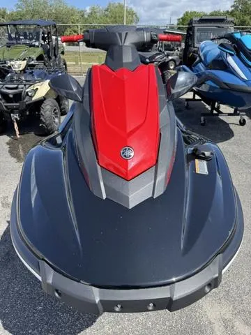 Slide: The Image of Outdoor display of Yamaha WaveRunner EX 2024 and other vehicles at a dealership. - 11