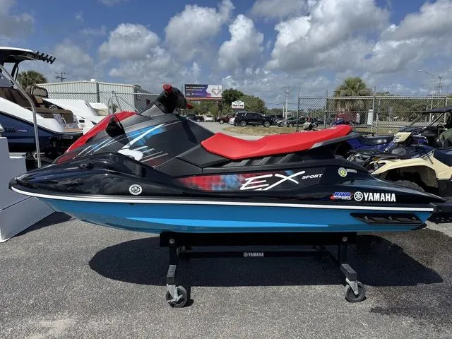 Slide: The Image of 2024 Yamaha WaveRunner EX in red, displayed outdoors on a stand. - 5