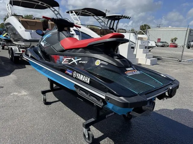 Slide: The Image of 2024 Yamaha WaveRunner EX in red, displayed outdoors on a stand. - 6