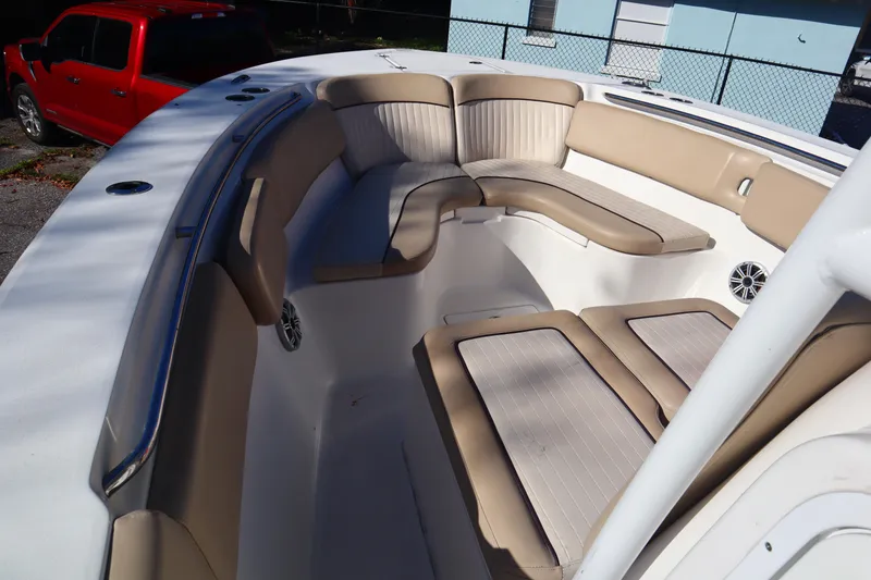 Slide: The Image of 2017 Sea Fox 288 Commander boat interior with beige seating and white deck. - 14