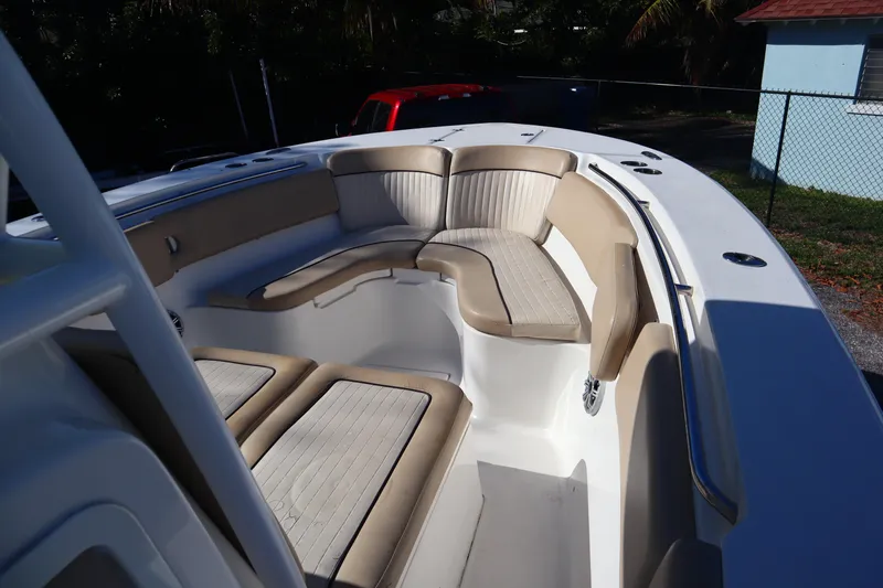 Slide: The Image of 2017 Sea Fox 288 Commander boat with spacious seating area and beige cushions. - 20