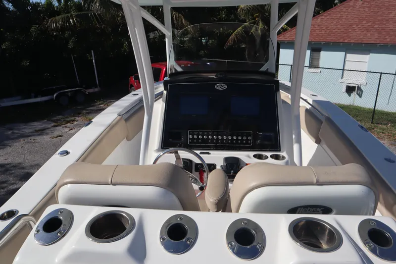 Slide: The Image of 2017 Sea Fox 288 Commander boat cockpit with dual seats and control panel. - 27