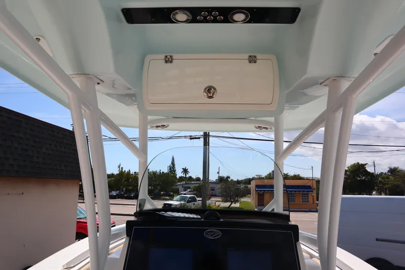 Slide: The Image of 2017 Sea Fox 288 Commander boat console with overhead storage and electronics. - 29