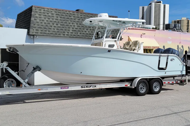 Slide: The Image of 2017 Sea Fox 288 Commander boat on trailer, parked outdoors. - 3