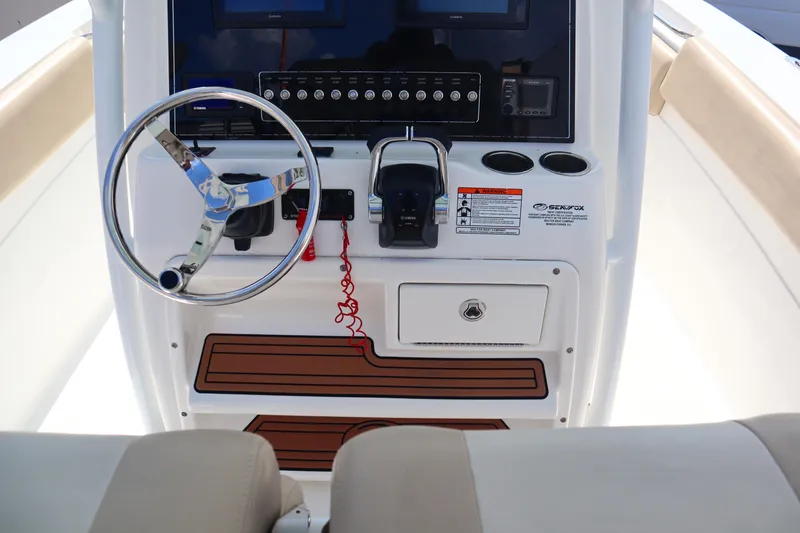 Slide: The Image of 2017 Sea Fox 288 Commander boat console with steering wheel and controls. - 31