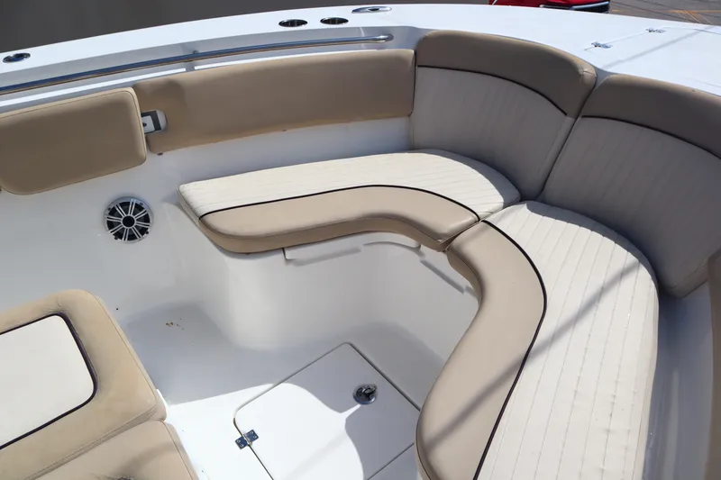Slide: The Image of 2017 Sea Fox 288 Commander boat with beige cushioned seating area. - 34