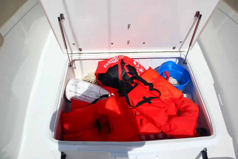 Slide: The Image of Storage compartment on 2017 Sea Fox 288 Commander with life jackets and boating gear. - 35