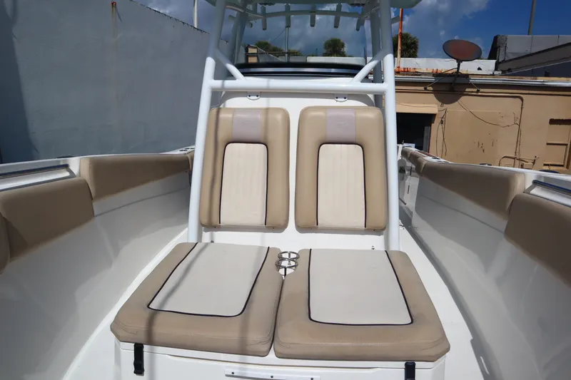 Slide: The Image of 2017 Sea Fox 288 Commander boat interior with beige seating and cup holders. - 36