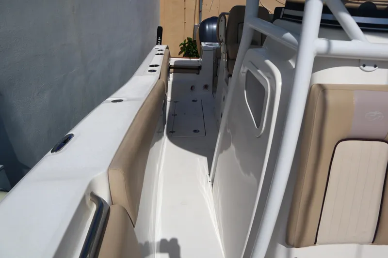 Slide: The Image of 2017 Sea Fox 288 Commander boat interior with beige seating and white deck. - 41