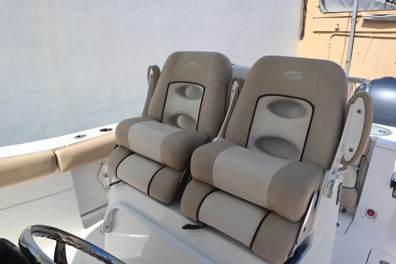 Slide: The Image of 2017 Sea Fox 288 Commander boat seats, beige upholstery, dual captain's chairs. - 43