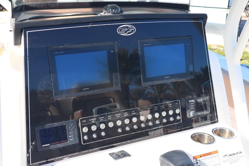 Slide: The Image of Control panel of 2017 Sea Fox 288 Commander boat with dual screens and buttons. - 9