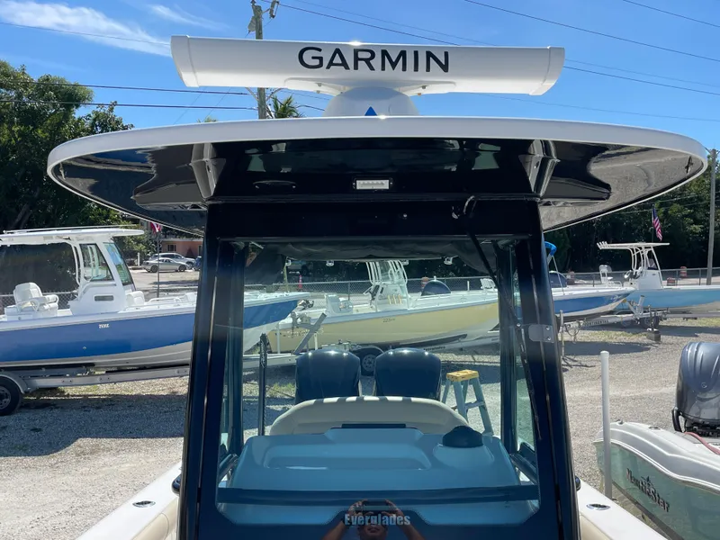 Slide: The Image of 2020 Everglades 273 Center Console boat with Garmin radar, docked in a marina. - 12
