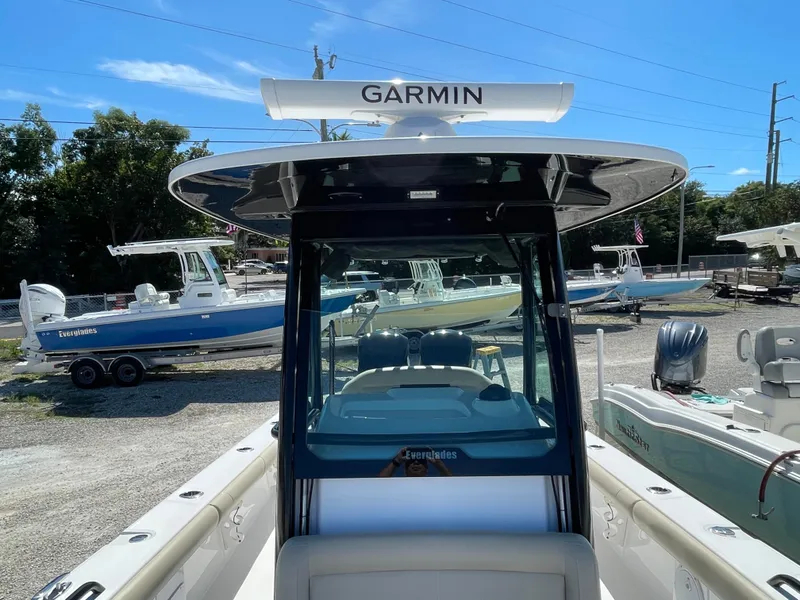 Slide: The Image of 2020 Everglades 273 Center Console boat with Garmin equipment, docked outdoors. - 13