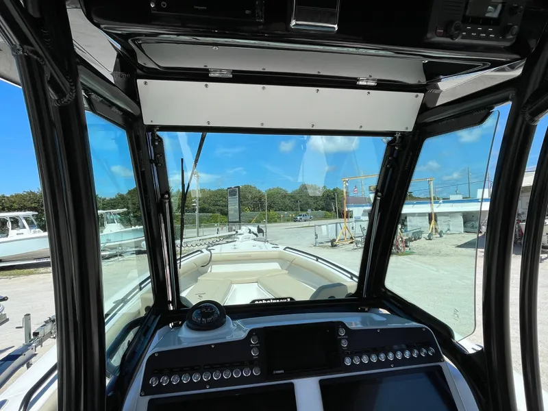 Slide: The Image of Interior view of 2020 Everglades 273 Center Console boat, showcasing dashboard and controls. - 25