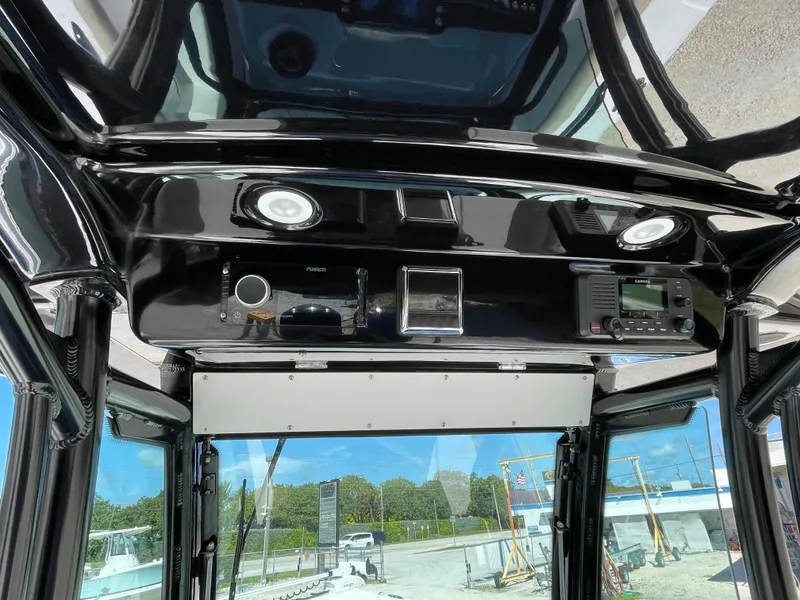 Slide: The Image of 2020 Everglades 273 Center Console boat interior with control panel and electronics. - 26