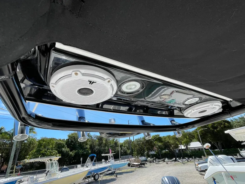 Slide: The Image of 2020 Everglades 273 Center Console boat speakers and lights under T-top. - 27