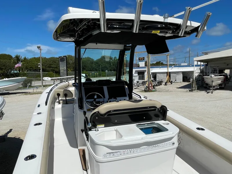 Slide: The Image of 2020 Everglades 273 Center Console boat with fishing rod holders and modern dashboard. - 29