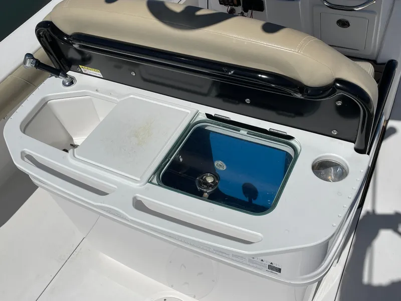 Slide: The Image of 2020 Everglades 273 Center Console boat with seating and storage compartments. - 31