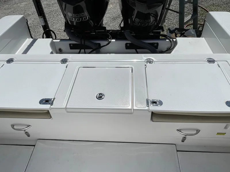 Slide: The Image of 2020 Everglades 273 Center Console boat with dual Yamaha engines, featuring storage compartments. - 33