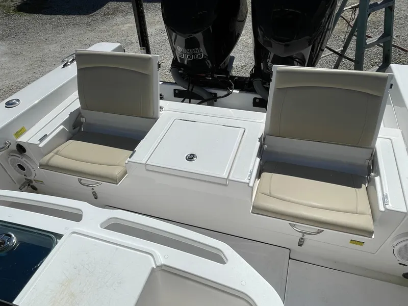 Slide: The Image of 2020 Everglades 273 Center Console boat with dual seats and storage compartment. - 34