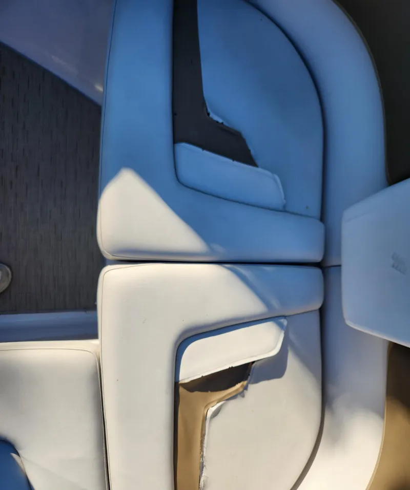 Slide: The Image of 2015 Four Winns Horizon H290 boat seating, white upholstery, top view. - 17