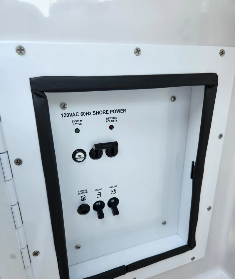 Slide: The Image of 120VAC 60Hz shore power panel on 2015 Four Winns Horizon H290 boat. - 9