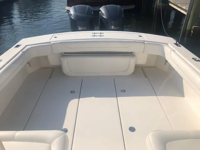 Slide: The Image of 2017 Albemarle 27 Express boat deck with twin 300 engines, spacious seating area. - 11