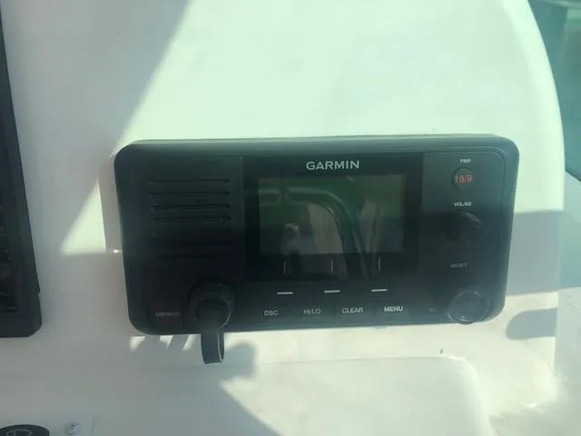 Slide: The Image of Garmin marine radio on 2017 Albemarle 27 Express boat dashboard. - 17