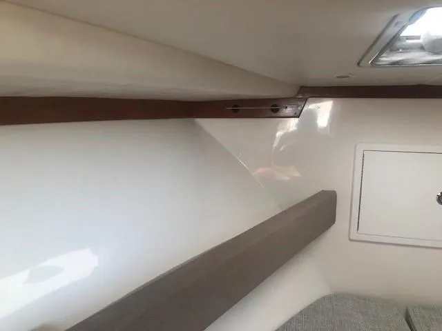 Slide: The Image of Interior cabin of 2017 Albemarle 27 Express boat, featuring sleek design and storage compartment. - 20