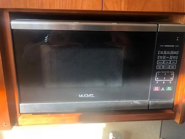 Slide: The Image of Microwave oven inside 2017 Albemarle 27 Express boat kitchen area. - 27