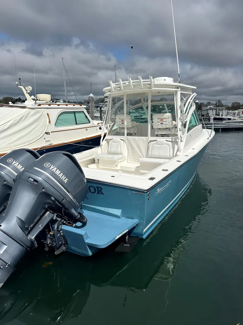 Slide: The Image of 2017 Albemarle 27 Express boat with Yamaha engines docked in marina. - 4