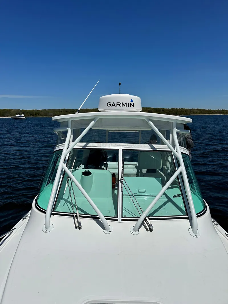 Slide: The Image of 2017 Albemarle 27 Express boat with Garmin equipment on a calm lake. - 7