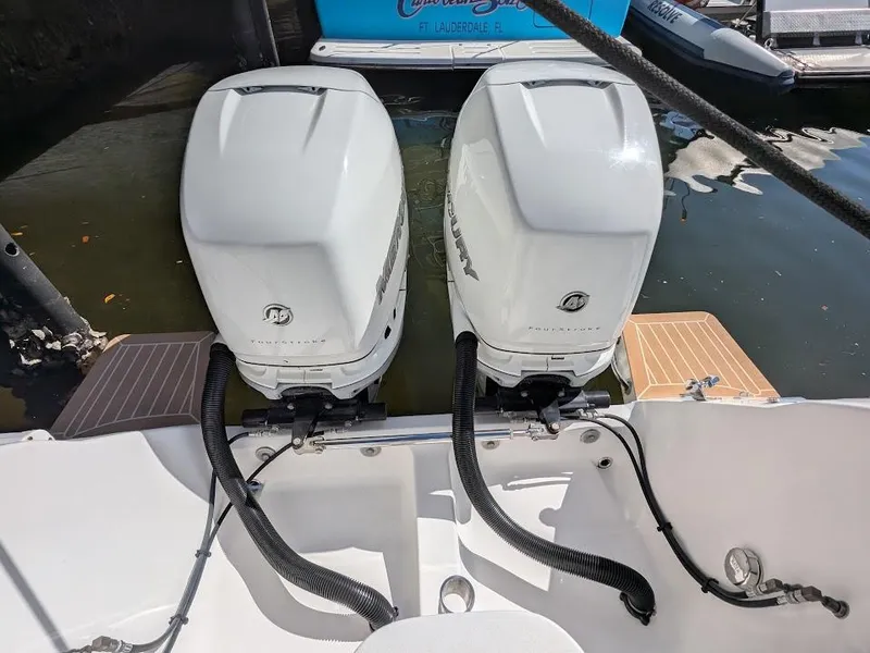 Slide: The Image of Twin outboard motors on a 2017 Intrepid 327 Center Console boat. - 12
