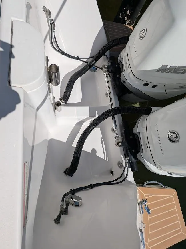 Slide: The Image of Intrepid 327 Center Console 2017 with upgraded motors, showcasing engine connections and deck details. - 13