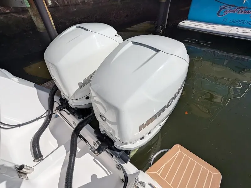 Slide: The Image of Twin Mercury outboard motors on a 2017 Intrepid 327 Center Console boat. - 14