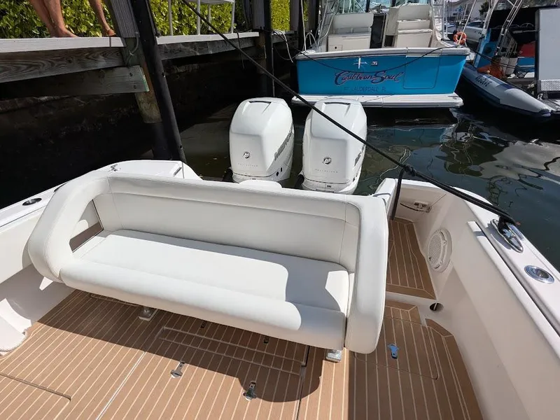 Slide: The Image of Intrepid 327 Center Console 2019 with upgraded motors, featuring a sleek seating area. - 15